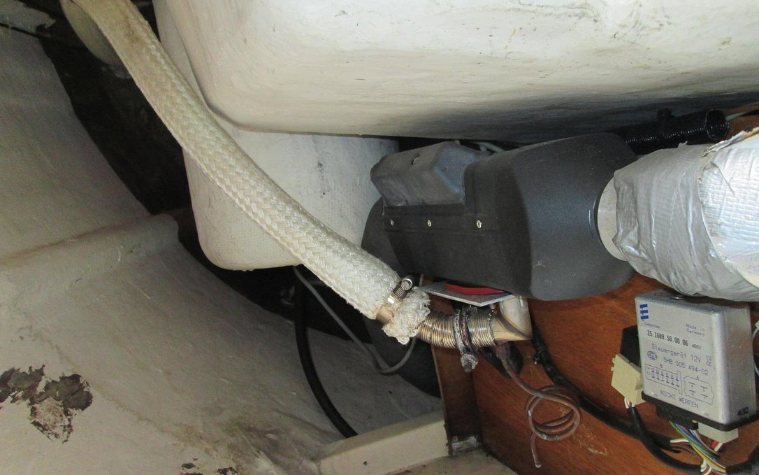 A photo of an espar diesel heating unit in the locker of a sailboat