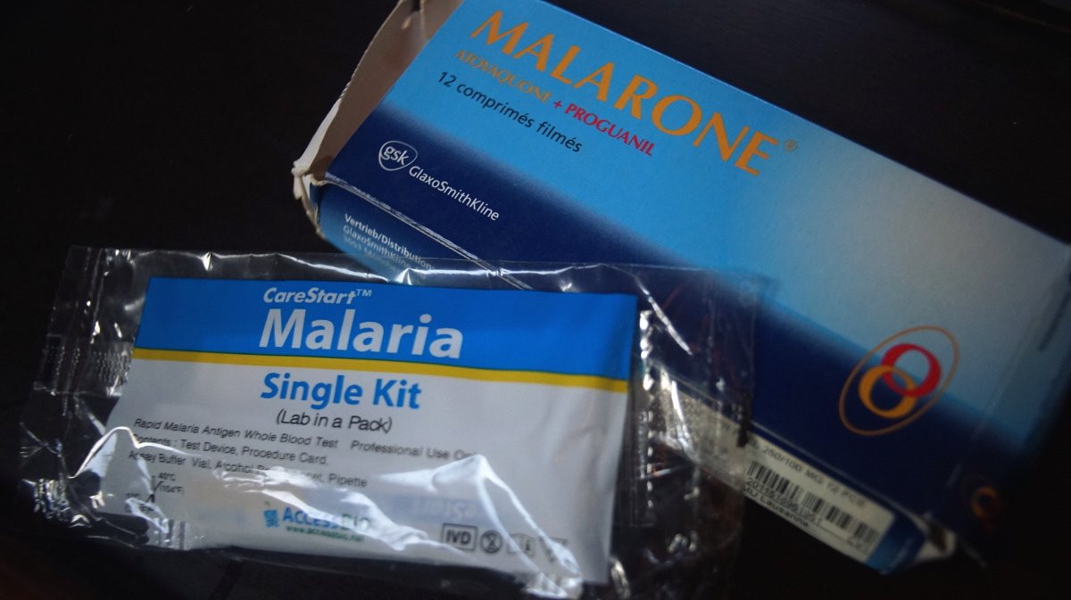 photo of a rapid malaria test kit and the antimalarials malarone