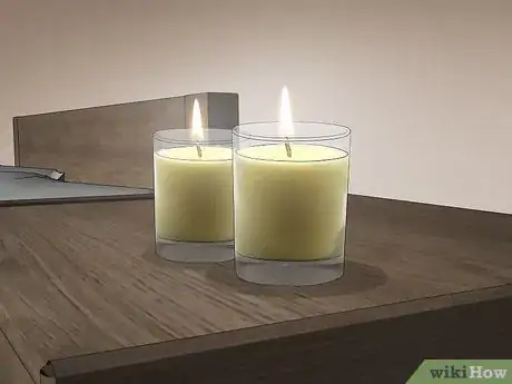 Step 2 Light scented candles to make your apartment smell more like home.
