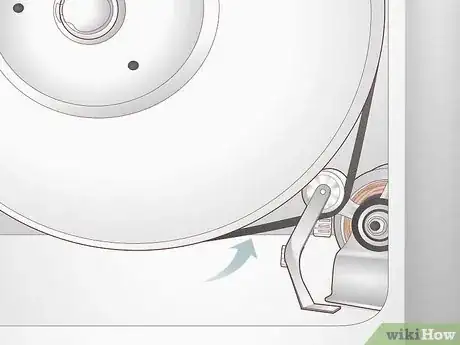Step 2 Locate the drive belt at the bottom of the drum.