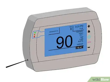 Step 1 Open the thermostat and press "reset" with an open paperclip or other small pointy object.