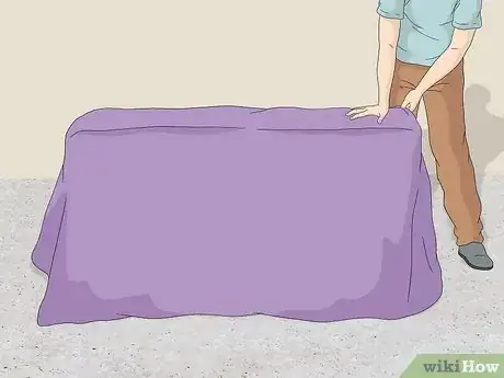 Step 1 Cover furniture with blankets or furniture pads.