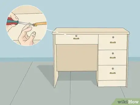 Step 5 Remove knobs and other removable pieces from dressers and desks.