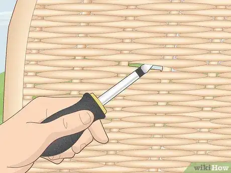 Step 3 Tighten loose rattan pieces with a screwdriver to get rid of holes.