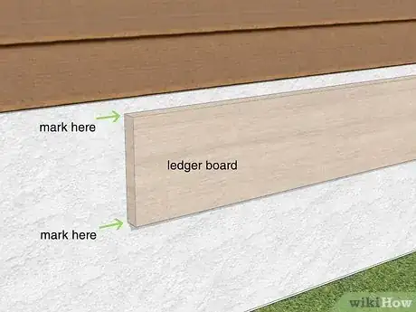 Step 1 Mark the top and bottom lines for the deck on your home.
