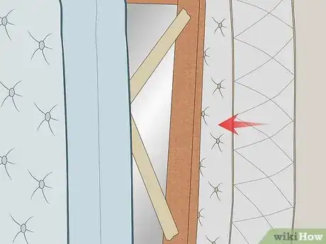 Step 2 Place pictures and mirrors between mattresses or other soft items.