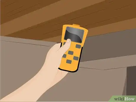 Step 2 Locate wood strapping or joists in the ceiling nearest the desired location with a commercially available stud finder.