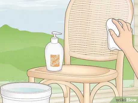 Step 2 Wipe down real, wooden rattan furniture with dish soap and water.