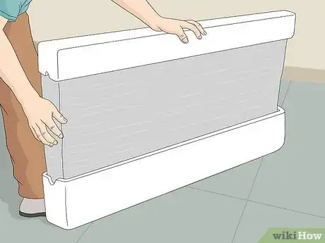 Step 2 Pack your television by covering it with a cloth and securing with plastic wrap.