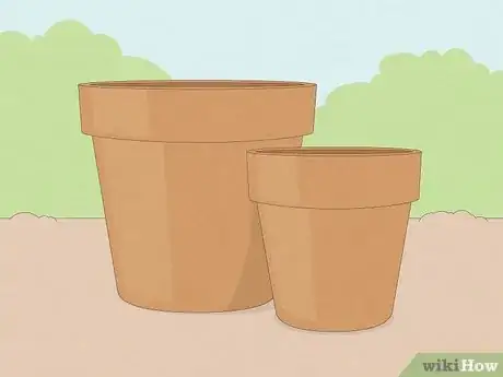 Step 1 Obtain two large clay or terracotta pots.