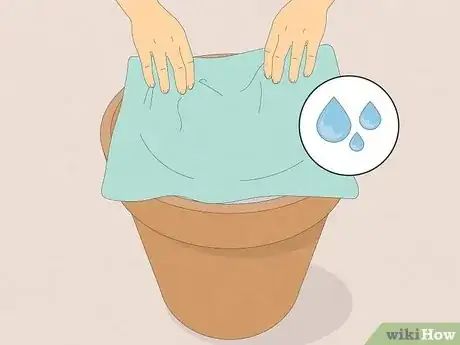 Step 7 Take a cloth, tea towel or towel and dip it into water.
